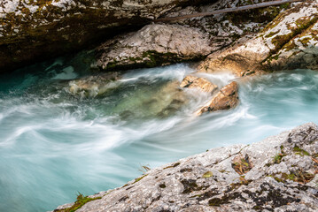 The Soca river flowing through a wild mountain landscape of the Julian Alps in Slovenia