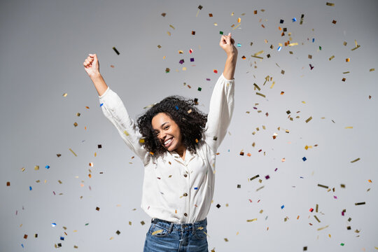 Joyful Woman Celebrating With Falling Confetti. Birthday, Christmas Or New Year Eve Celebration, Having Fun, Enjoy Life Concept