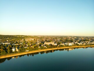 Aerial view of the Bonn city on the waterfront at calm sunset
