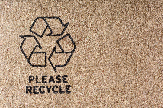 recycle symbol on cardboard, please recycle text with icon