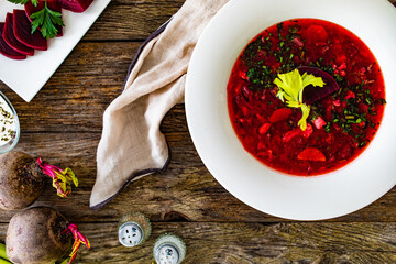 Borsch - beetroots soup on wooden table
