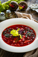 Borsch - beetroots soup on wooden table
