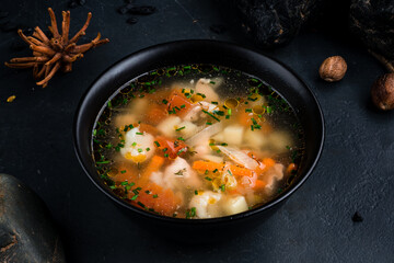 Chicken broth with potatoes, onions, tomatoes, carrots and herbs.