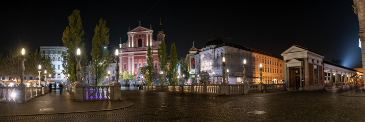 Famous Three Bridges and the Preseren square in the center of Ljubljana illuminated at night