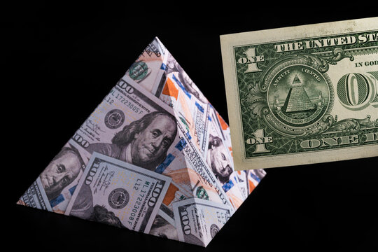 1 US dollar banknote and 100 US dollar pyramid