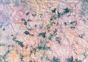 Crumpled paper with paint stains.