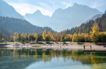 Scenic autumn forest at Crystal Lake in the Julian Alps in Slovenia