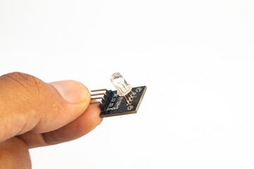 A closeup of an RGB LED module in hand. This module is used for electronics hobbyists for DIY...
