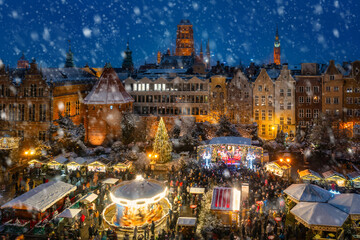 Beautifully lit Christmas market in the Main City of Gdansk during a snowfall. Poland