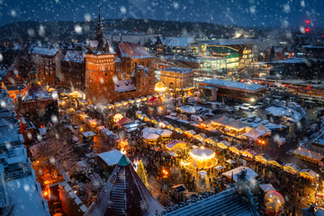 Beautifully lit Christmas market in the Main City of Gdansk during a snowfall. Poland
