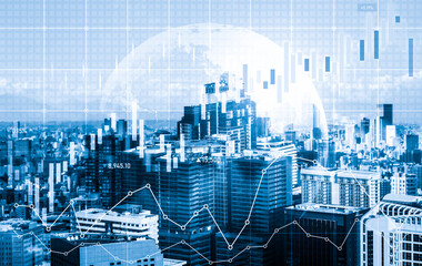 As background for a financial or business concept, digital screen and financial graphs overlap on a picture of modernistic cityscape, skyscrabbers.