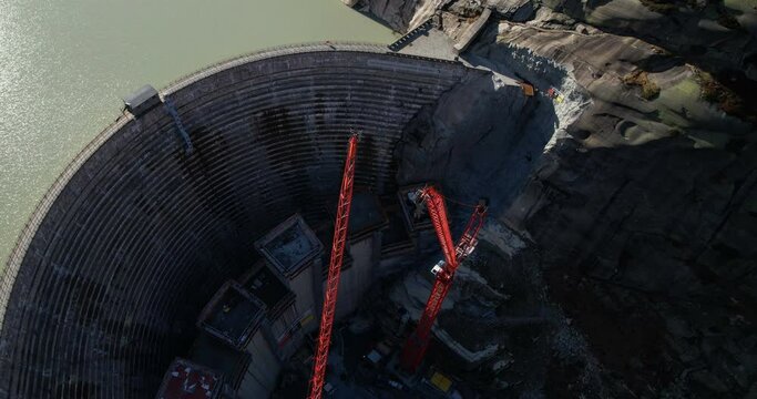 Grimselsee new dam in construction - Aerial back travelling 4K
