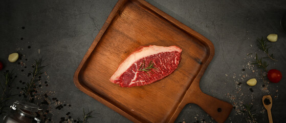 Picanha raw beef steak on wooden cutting board