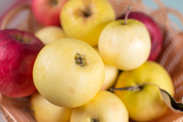 Organic fruits, ripe apples on the table.