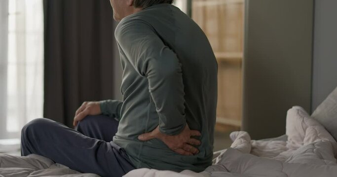 Old man with pain in back	