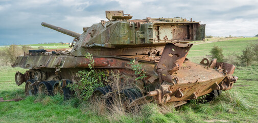 visible patina along the side of an abandoned rusting British FV4201 Chieftain main battle tank...