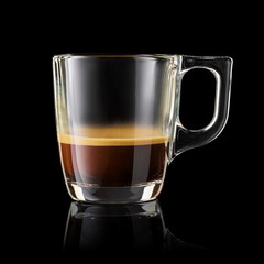 Glass cup of espresso coffee isolated on black.