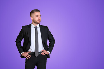 Businessman with confident look on copy space purple background