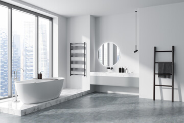 Fototapeta na wymiar Corner view on bright bathroom interior with bathtub, panoramic window