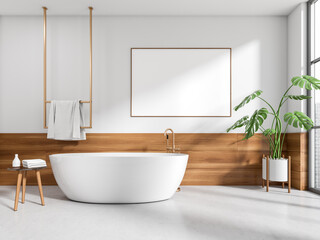Bright bathroom interior with bathtub, empty poster, panoramic window