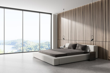 Stylish bedroom interior with bed near panoramic window. Empty wall