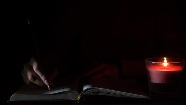 a candle and a notebook