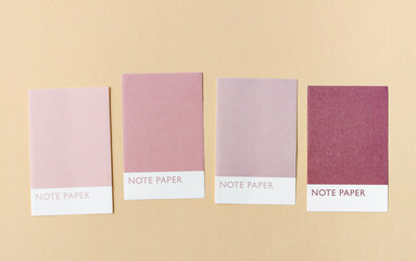 Collection of four colorful blank notes adhesives paper for your text or message on yellow background.