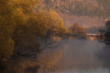 in a misty foggy morning on the river. Bóbr river in the Bóbr valley in the surrondings of Pilchowice in Poland in autumn © magdagalkiewicz
