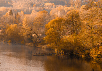 in a misty foggy morning on the river. Bóbr river in the Bóbr valley in the surrondings of Pilchowice in Poland in autumn © magdagalkiewicz