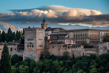 Fototapeta na wymiar Evening view of the Alhambra palace in Granada, Spain with Sierra Nevada in background