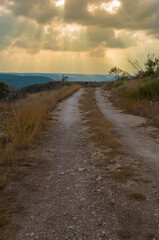 Fototapeta na wymiar Dirt road in Texas Hill Country about to get wet