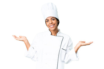 Young African American chef over isolated chroma key background having doubts while raising hands