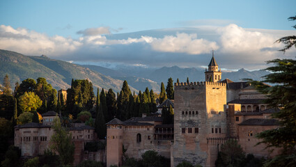 Evening view of the Alhambra palace in Granada, Spain with Sierra Nevada in background