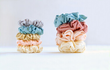 pyramids of silk beige Scrunchies on white. Luxury Hair accessories. Elastic Bands, Bobble Hairband