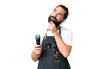 Young barber man over isolated chroma key background and looking up