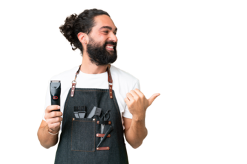 Young barber man over isolated chroma key background pointing to the side to present a product