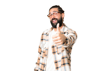 Young man with beard over isolated chroma key background with thumbs up because something good has happened