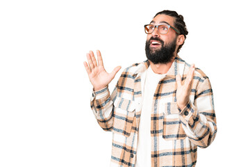 Young man with beard over isolated chroma key background with surprise facial expression