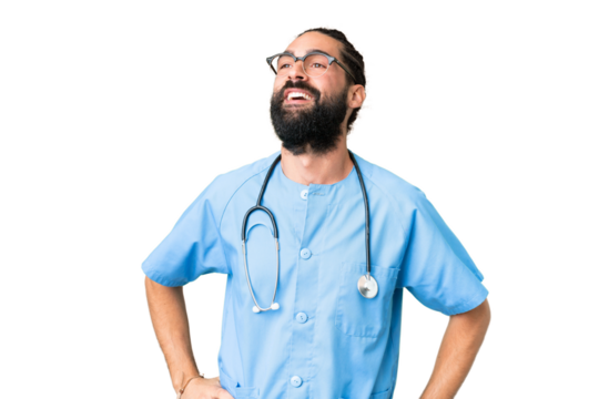 Young doctor man over isolated chroma key background posing with arms at hip and smiling