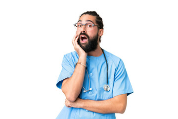 Young doctor man over isolated chroma key background surprised and shocked while looking right