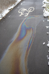 Oil spill on asphalt in road bike. background or texture
