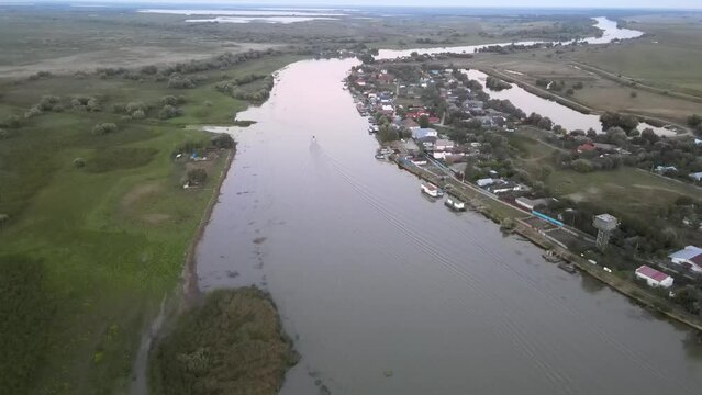 Drone view over the tiny village Mila 23 on the Danube river