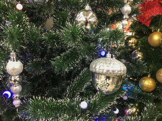 Christmas toys and balls on the Christmas tree. Festive Christmas toys. Christmas decorations....