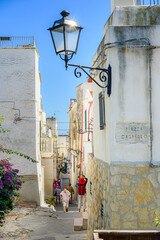 Vieste, Italy. View of a characteristic narrow street in the historic center of the town, near...