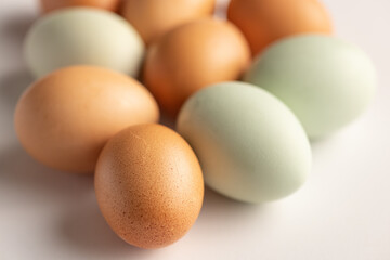 Closeup of green and brown raw, organic eggs