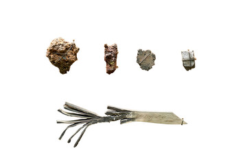 Ore and sample products of a medieval blacksmith for the manufacture of metal products, isolated on a white background. Reconstruction of the events of the Middle Ages in Europe.