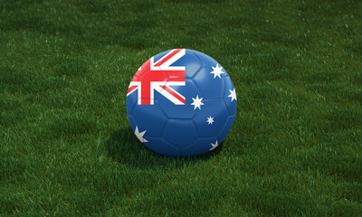 Soccer ball with Australia flag colors at a stadium on green grasses background.