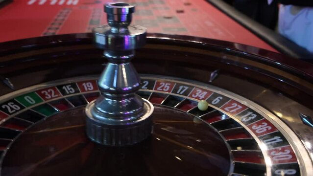 The ball jumps on the roulette table in the casino