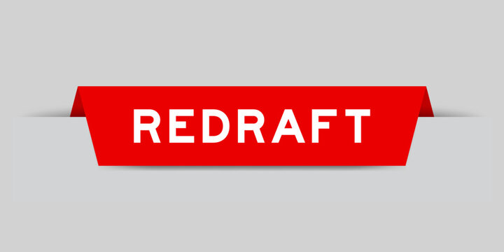 Red color inserted label with word redraft on gray background