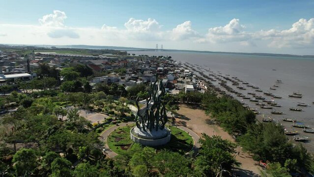 Aerial view of the A giant shark and crocodile statue as a symbol of the city of Surabaya. A landmark or monument as an icon of Surabaya city.